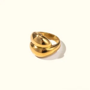 18K gold twisted dome ring front view flat lay polished finish overlapping curved band design luxe statement jewelry