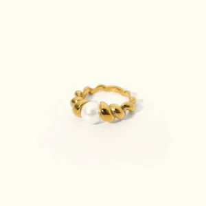 18K gold twisted freshwater pearl ring flat lay studio view with minimalist white background showcasing lustrous pearl and polished gold band