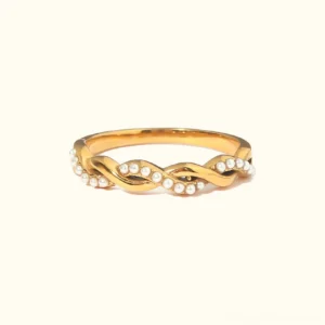 18K gold twisted pearl ring flat lay front view - polished gold band with embedded freshwater pearls on neutral background
