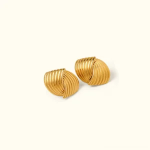18K gold twisted stud earrings flat lay top-down view with warm gold tone ribbed texture against neutral background