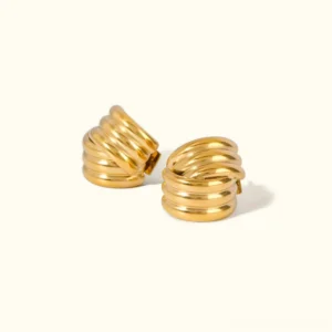 18k gold twisted stud earrings flat lay top view polished finish geometric layered design
