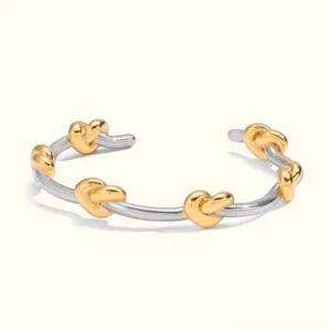 18K gold two-tone knot cuff bangle open cuff design flat lay top view showing silver and gold mixed metals