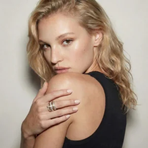 18K gold two-tone stacked diamond ring worn on model's hand three-quarter side view showcasing layered design and sparkle
