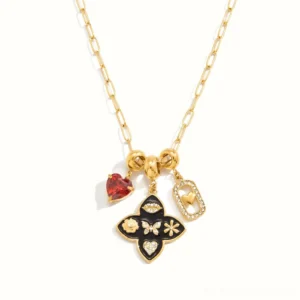 18k gold vintage charm necklace with eye butterfly and heart pendant flat lay front view white background