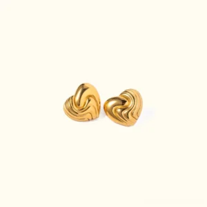18K gold wavy heart stud earrings flat lay top-down view, polished gold finish with embossed wave patterns