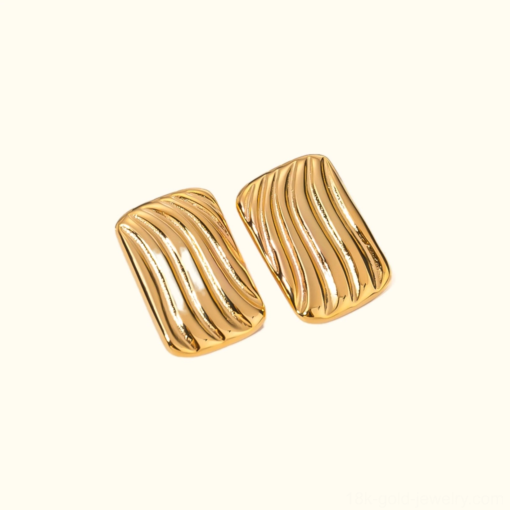 18K gold wavy rectangular stud earrings flat lay top view premium quality finish