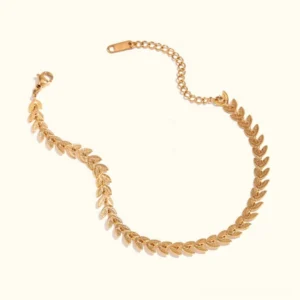 18K gold wheat leaf chain bracelet flat lay overhead view with extender chain and lobster claw clasp on white background