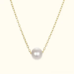 18k yellow gold freshwater pearl pendant necklace front flat lay close-up with lustrous round white pearl on delicate gold cable chain