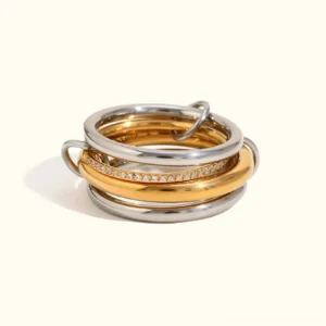 18K yellow gold Stella diamond stack ring three-band layered design flat lay product view with pavé diamond band on white background