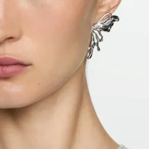 Butterfly silver earrings worn on model ear side view close-up hypoallergenic stainless steel