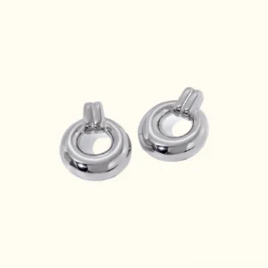 Chunky silver hoop earrings with dual-band stud construction, flat lay front view showing polished finish and hollow circular design