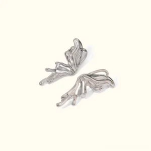 Silver butterfly stud earrings flat lay product photography polished metallic finish hollow wing design 46mm