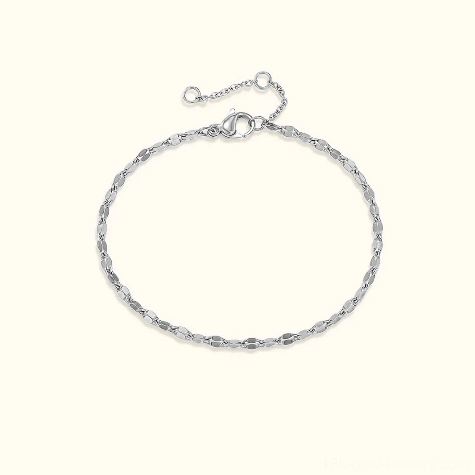 Silver polished lace chain bracelet with flat oval links on light background, showing adjustable extender clasp design