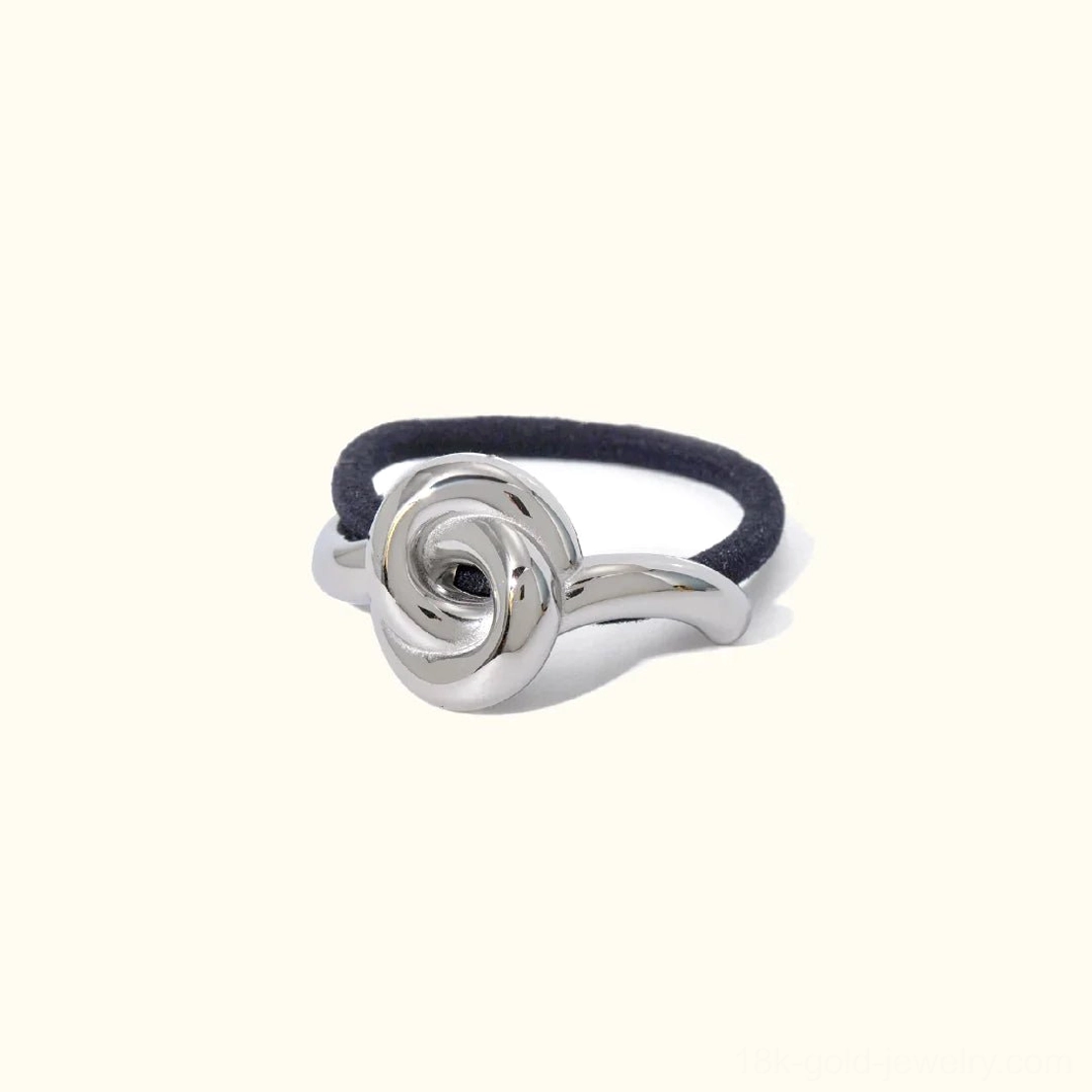 Silver polished rose knot hair cuff with black elastic band front view