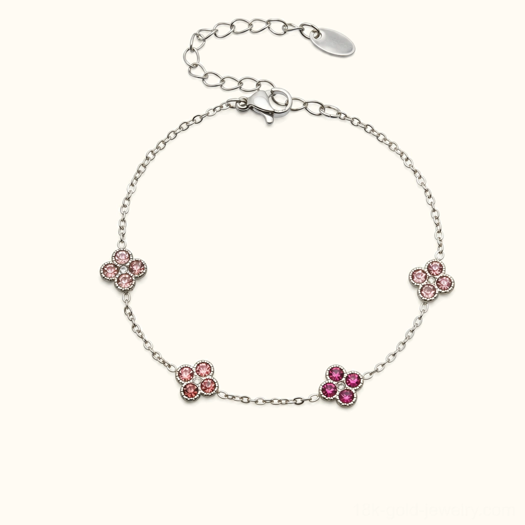 Sterling silver four-leaf clover bracelet with pink tourmaline gemstone charms, elegant jewelry product view
