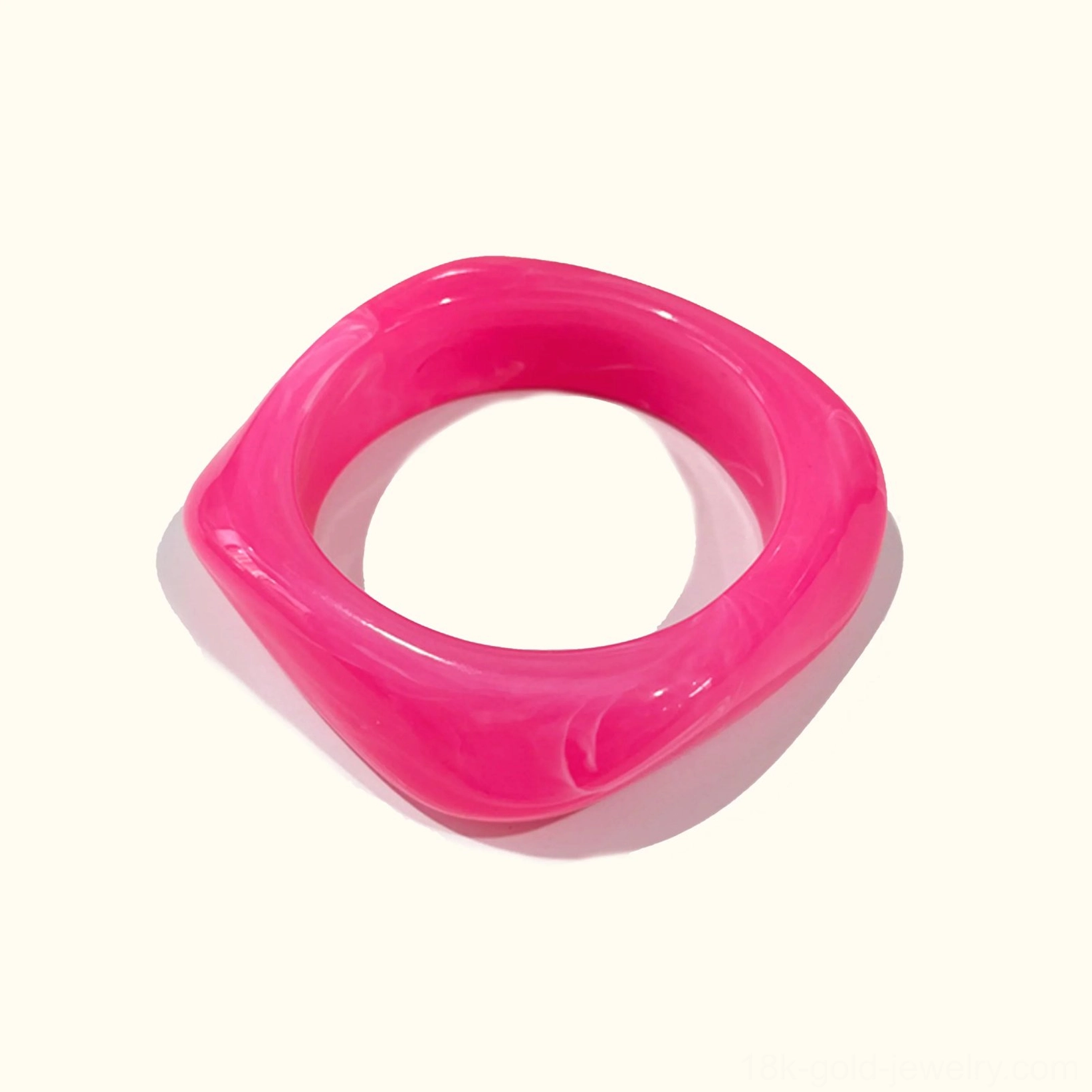Very Berry rich jewel-toned berry colored acrylic bangle bracelet with solid opaque finish, rounded square shape flat lay view